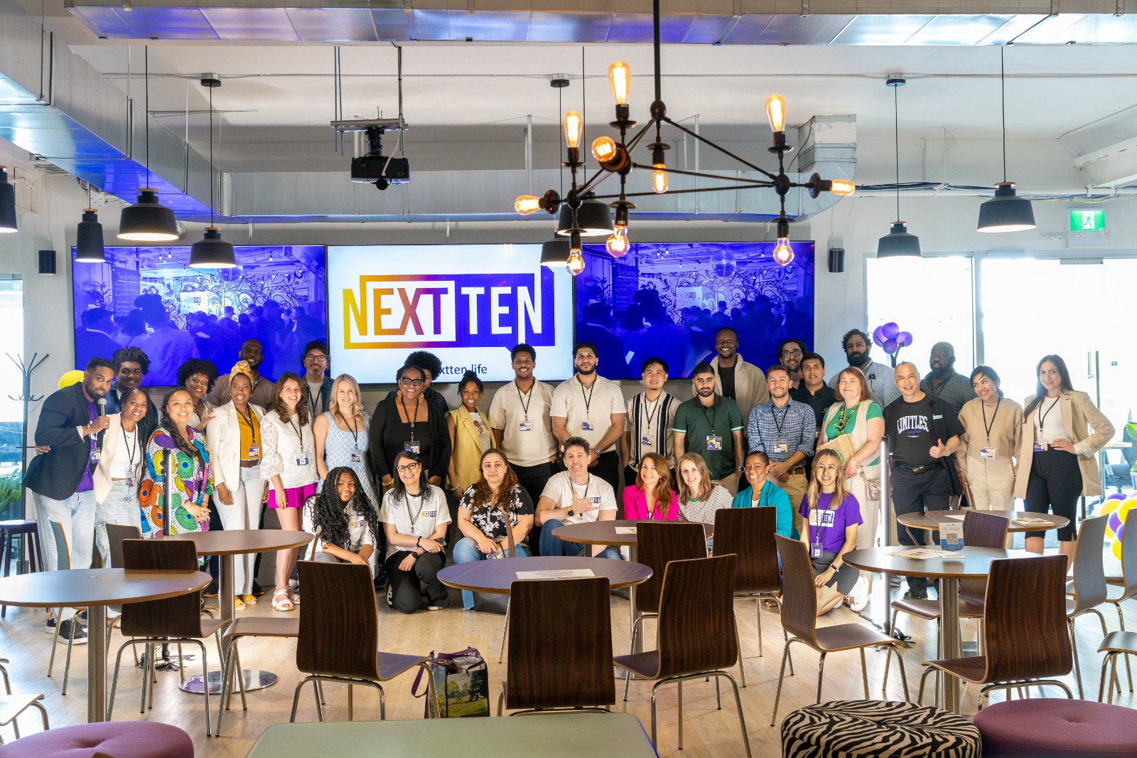 Group photo of attendees at a NEXT TEN community experience